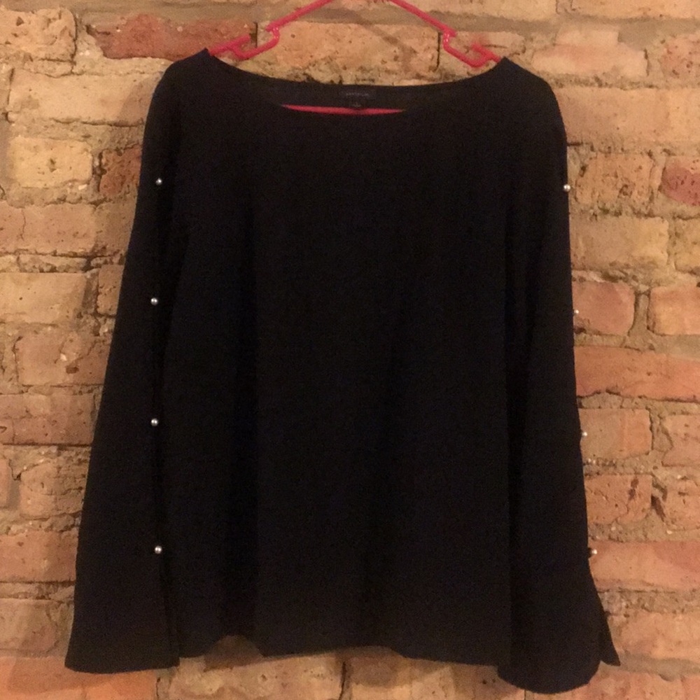 Black top with pearl openings down sleeve